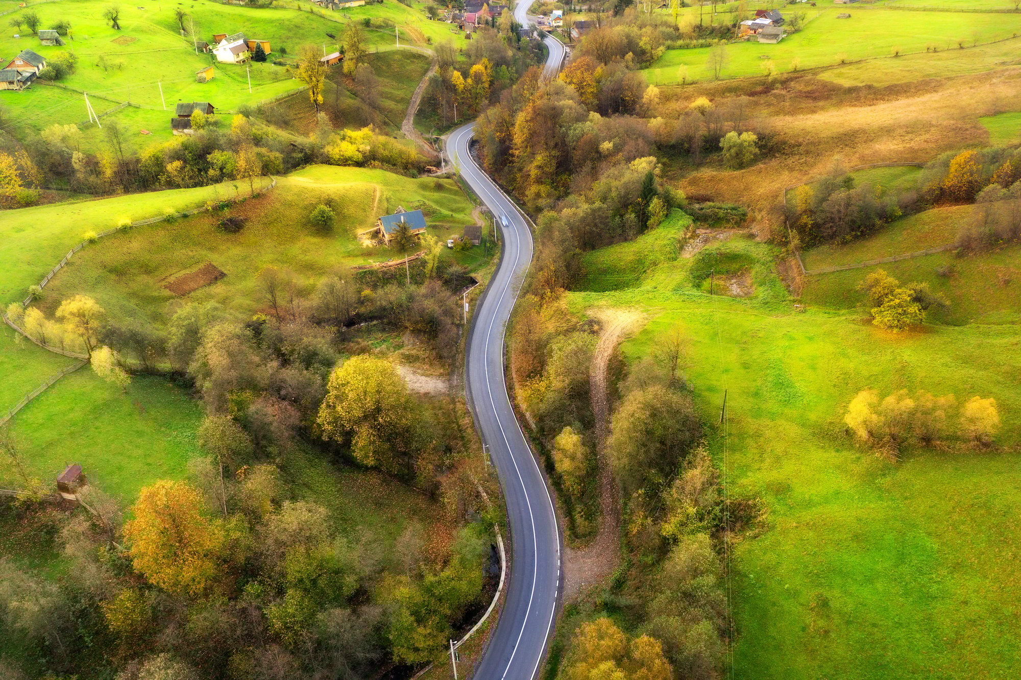 aerial-view-of-beautiful-winding-road-in-green-hil-2024-12-04-23-12-24-utc_75