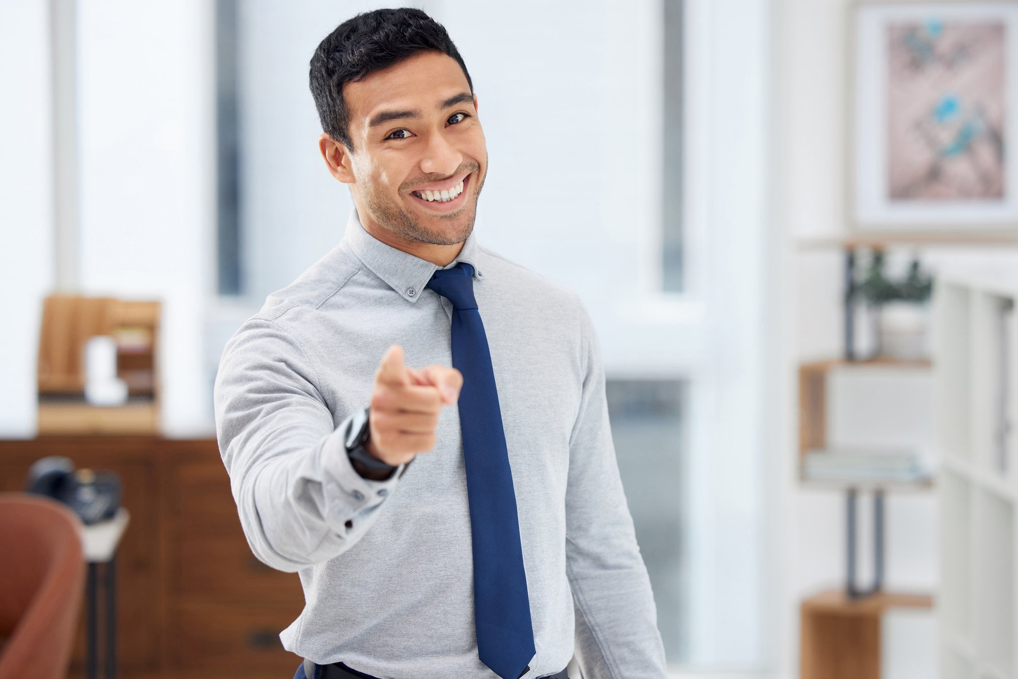 young-happy-mixed-race-businessman-pointing-a-fing-2025-04-06-11-52-27-utc young-happy-mixed-race-businessman-pointing-a-fing-2025-04-06-11-52-27-utc